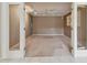 Spacious living room features neutral tones, ceiling fan, and built-in shelving for ample storage and comfort at 13636 Lake Point S Dr, Clearwater, FL 33762
