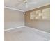 Bright living room showcasing neutral tones, ceiling fan, and built-in shelving for modern comfort at 13636 Lake Point S Dr, Clearwater, FL 33762