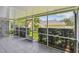 Screened in patio with view of lawn at 13636 Lake Point S Dr, Clearwater, FL 33762