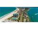 Scenic aerial of a beachfront community showing condos, beaches, and azure waters at 1380 Gulf Blvd # 805, Clearwater, FL 33767