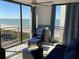 Relax on the balcony with comfortable seating and enjoy panoramic ocean views on a sunny day at 1380 Gulf Blvd # 805, Clearwater, FL 33767