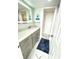Nicely renovated bathroom featuring a modern vanity, updated fixtures, and a lighted mirror at 1380 Gulf Blvd # 805, Clearwater, FL 33767