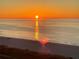 Beautiful beach view at sunrise with calm waters at 1380 Gulf Blvd # 805, Clearwater, FL 33767