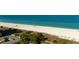 Beautiful beach with palm trees and a parking area at the condominium complex at 1380 Gulf Blvd # 805, Clearwater, FL 33767