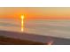 Breathtaking beach sunrise with vibrant colors over the ocean and sandy shoreline at 1380 Gulf Blvd # 805, Clearwater, FL 33767