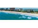 Stunning beachfront view with turquoise waters and high-rise buildings in the background, creating a serene coastal setting at 1380 Gulf Blvd # 805, Clearwater, FL 33767