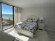 Bright bedroom with ocean view, white furniture, and coastal-themed bedding at 1380 Gulf Blvd # 805, Clearwater, FL 33767