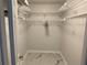 Walk-in closet with ample white wire shelving and stylish marble tile floor at 1380 Gulf Blvd # 805, Clearwater, FL 33767