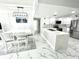 Bright kitchen with stainless appliances, stylish countertop, and an adjacent dining area at 1380 Gulf Blvd # 805, Clearwater, FL 33767