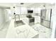 Contemporary kitchen featuring new cabinets, stainless appliances, and elegant countertops at 1380 Gulf Blvd # 805, Clearwater, FL 33767