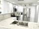 Modern kitchen showcases new cabinets, stainless appliances, and stylish backsplash at 1380 Gulf Blvd # 805, Clearwater, FL 33767