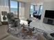 Sunlit living room with ocean views, modern furnishings, and stylish decor, creates a welcoming atmosphere at 1380 Gulf Blvd # 805, Clearwater, FL 33767