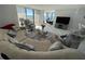 Spacious living room with beach-themed decor, plush seating, and stunning views of the ocean at 1380 Gulf Blvd # 805, Clearwater, FL 33767