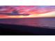 Stunning ocean view featuring a vibrant sunset over the water and beach at 1380 Gulf Blvd # 805, Clearwater, FL 33767