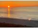 Gorgeous ocean view with the sun shining on the tranquil water and beach at 1380 Gulf Blvd # 805, Clearwater, FL 33767