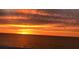 Vibrant sunset with an array of orange and yellow hues reflecting off the ocean, creating a serene atmosphere at 1380 Gulf Blvd # 805, Clearwater, FL 33767