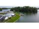 Stunning aerial view featuring lakes surrounded by lush forests and charming residential communities, Florida living at its finest at 1407 Brattleboro Cir, Sun City Center, FL 33573