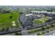 Aerial view showcasing community center with golf course, pool, and parking at 1407 Brattleboro Cir, Sun City Center, FL 33573
