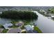 Expansive aerial view showcasing waterfront homes, providing serene water views and lush surrounding landscapes at 1407 Brattleboro Cir, Sun City Center, FL 33573