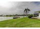 Well-maintained backyard with a waterfront view, a private boat dock, and a serene setting at 1407 Brattleboro Cir, Sun City Center, FL 33573
