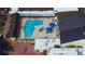 Aerial view of the community pool and surrounding recreational area in Sun City Center at 1407 Brattleboro Cir, Sun City Center, FL 33573