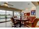 Dining area with slider to the lanai and beautiful lake view at 1407 Brattleboro Cir, Sun City Center, FL 33573