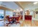 Inviting dining room area with water views and adjacent bar seating area at 1407 Brattleboro Cir, Sun City Center, FL 33573