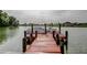 Wooden dock along water, ideal for boating, with beautiful waterfront views at 1407 Brattleboro Cir, Sun City Center, FL 33573