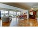 Open concept living space features a lake view and adjacent kitchen and dining area at 1407 Brattleboro Cir, Sun City Center, FL 33573