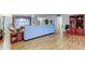 Bright living room with lots of natural light and hardwood floors and comfortable furniture at 1407 Brattleboro Cir, Sun City Center, FL 33573