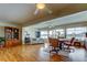 Open living space with hardwood floors, dining table, and access to the outdoor patio at 1407 Brattleboro Cir, Sun City Center, FL 33573