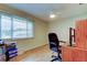 Office space with natural light, laminate flooring, and an office chair at 1407 Brattleboro Cir, Sun City Center, FL 33573