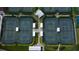 Aerial view of well-maintained tennis courts, perfect for residents to enjoy active outdoor recreation at 1407 Brattleboro Cir, Sun City Center, FL 33573
