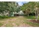 An expansive backyard with mature trees and a well maintained lawn at 152 58Th S Ave, St Petersburg, FL 33705