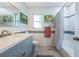 Bathroom featuring subway tile, a gray vanity, and a shower with a curtain at 152 58Th S Ave, St Petersburg, FL 33705