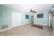 Bedroom featuring terrazzo floors, ceiling fan, and closet with sliding doors at 152 58Th S Ave, St Petersburg, FL 33705