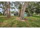 Charming single-story home with mature trees and lush lawn at 152 58Th S Ave, St Petersburg, FL 33705