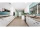 Bright kitchen with white cabinets, stainless steel appliances, and granite countertops at 152 58Th S Ave, St Petersburg, FL 33705