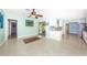 Spacious living area showing Terrazzo floors, neutral tones, and open access to kitchen at 152 58Th S Ave, St Petersburg, FL 33705