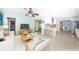 Open living area with a large TV, sliding glass doors to the backyard, and a breakfast bar at 152 58Th S Ave, St Petersburg, FL 33705