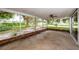 A partially-covered patio features a view of the well-maintained lawn at 152 58Th S Ave, St Petersburg, FL 33705