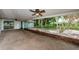 Covered patio with exposed brick and view of landscaped backyard at 152 58Th S Ave, St Petersburg, FL 33705