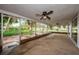 A partially-covered patio features a view of the manicured backyard at 152 58Th S Ave, St Petersburg, FL 33705