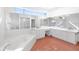 Bright bathroom with a large vanity, double sinks, and natural light at 15612 Howell Park Ln, Tampa, FL 33625