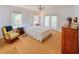 Cozy bedroom with French doors, wood floors, and comfortable furniture at 15612 Howell Park Ln, Tampa, FL 33625