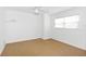 Bright bedroom featuring neutral carpeting and a window at 15612 Howell Park Ln, Tampa, FL 33625