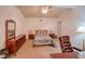 A bedroom featuring neutral carpeting, a ceiling fan, and natural light at 15612 Howell Park Ln, Tampa, FL 33625
