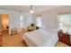 Inviting bedroom with natural light, wood floors, and cozy decor at 15612 Howell Park Ln, Tampa, FL 33625