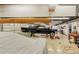 A two car garage featuring auto lift, high ceilings and natural lighting at 15612 Howell Park Ln, Tampa, FL 33625