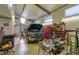 A garage featuring an automotive lift and an open table with auto parts at 15612 Howell Park Ln, Tampa, FL 33625